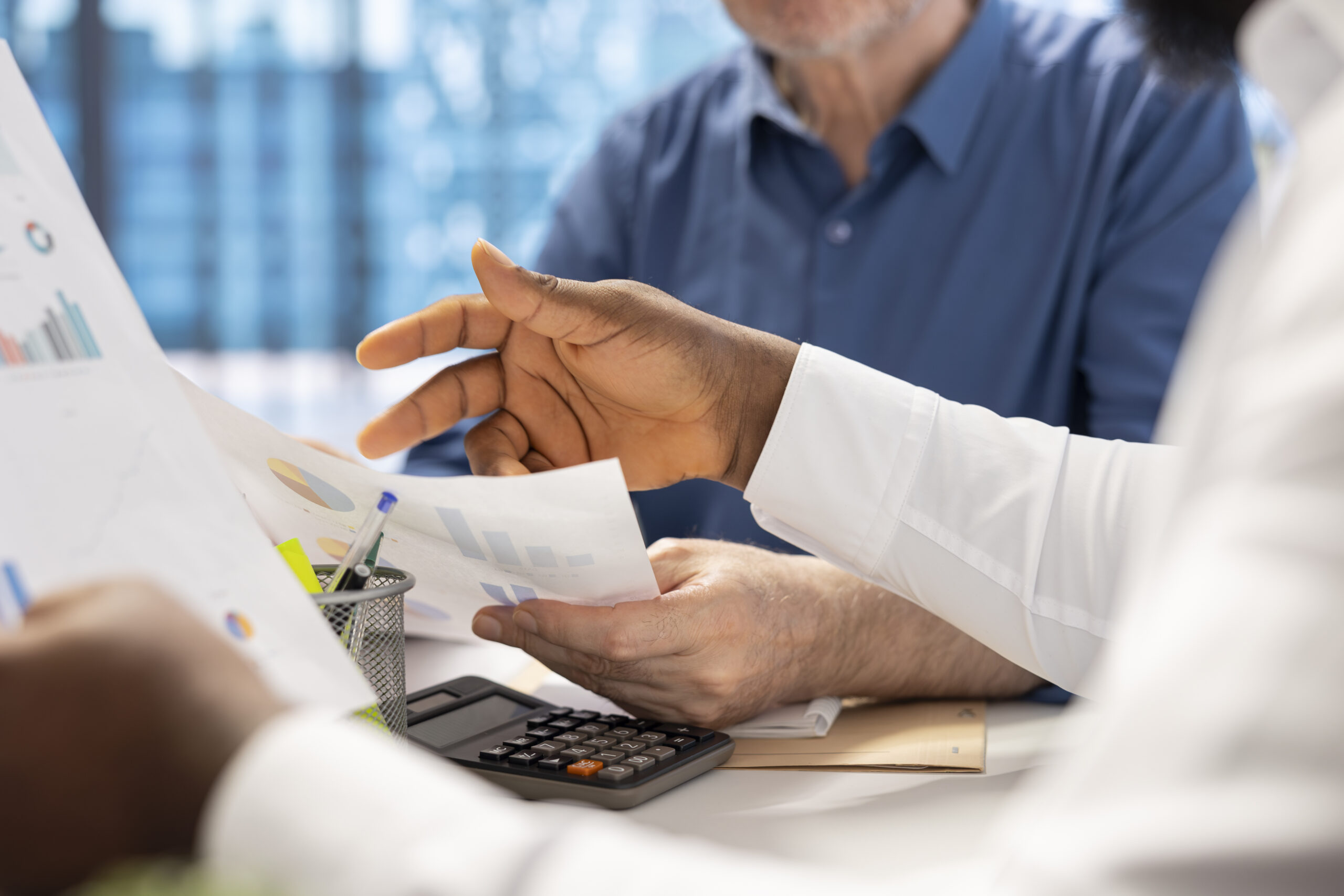 Senior people consulting with their financial banker about retirement plans